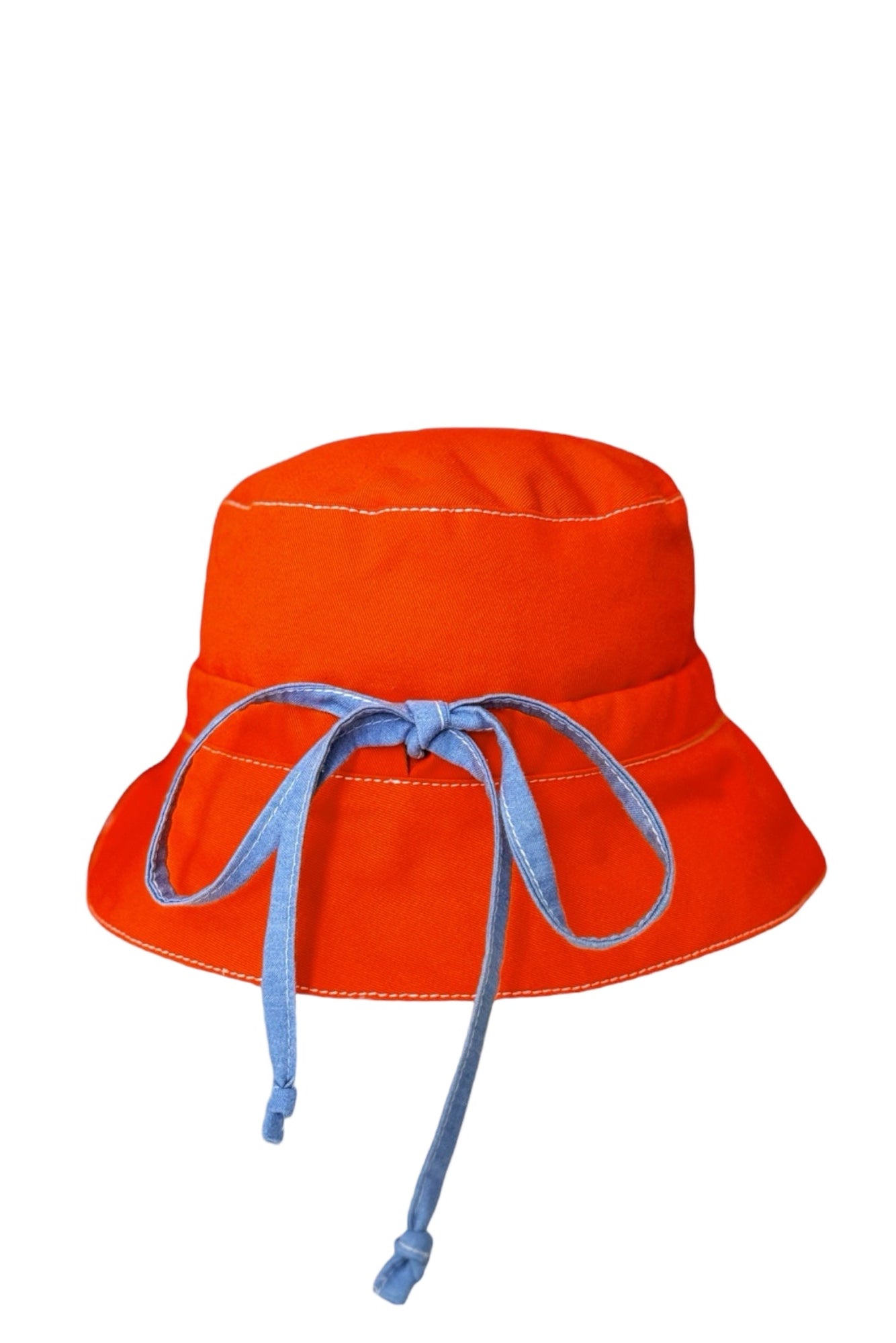 Introducing our versatile summer hat in deep orange denim featuring a stylish combination of white and navy striped cotton. The slim tie on the back allows for adjustable sizing, ensuring a perfect fit. Embrace the warmth of the sun while looking effortlessly chic.  DETAILS AND CARE  Fabric - denim 100% cottoton, &nbsp;70% Ramie 30% cotton  Hand wash