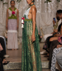 Long women’s jumpsuit with lace bodice, floral details, decorative ties, tassels and wide-leg trousers.