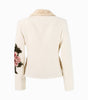 Beige jacket with floral arm designs on a white background