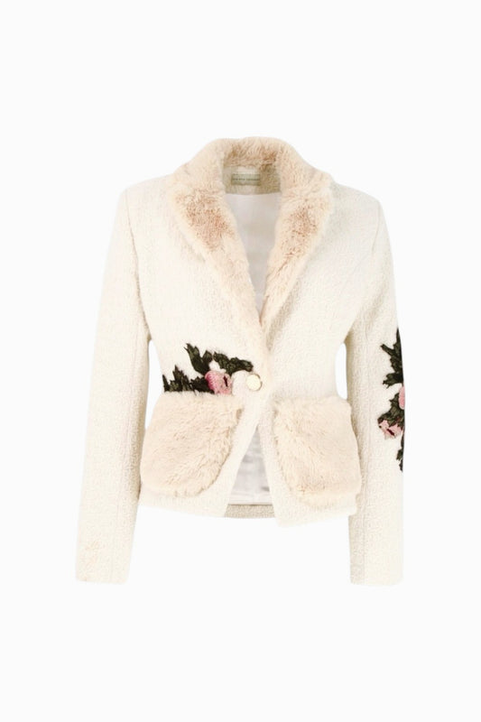 Cream-colored cardigan with floral embroidery on a white background