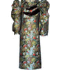 Floral patterned dress with a large bow on a white background