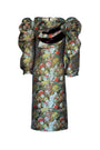 Floral patterned dress with a large bow on a white background
