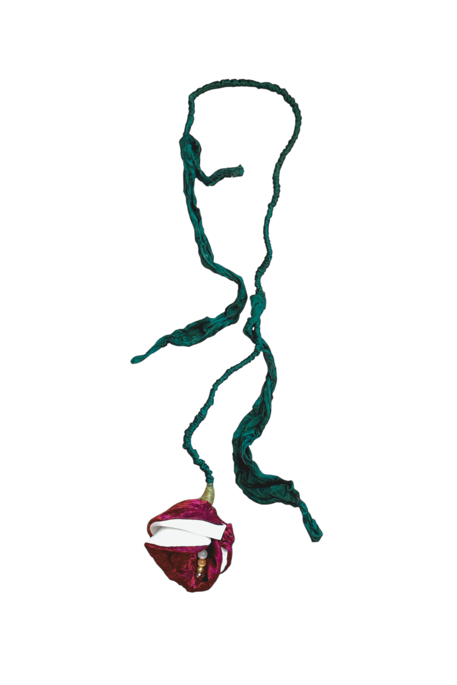 Green knitted necklace with a red pendant on a white background