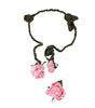 Hair accessory with pink flowers and braided design on a white background
