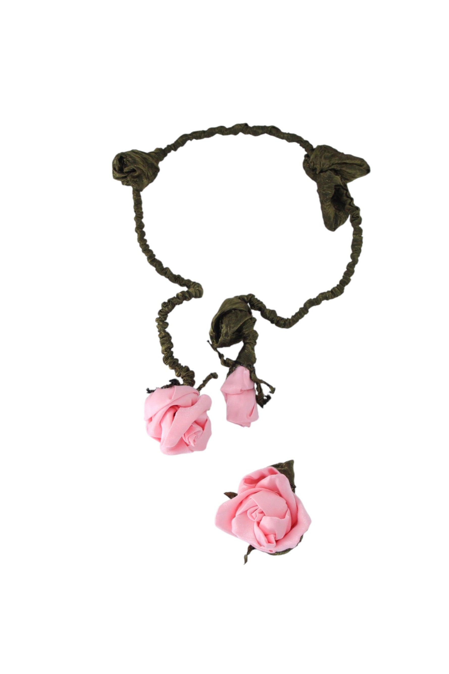Hair accessory with pink flowers and braided design on a white background