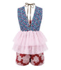 Multicolored floral dress with a pink ruffled top and red shorts on a white background