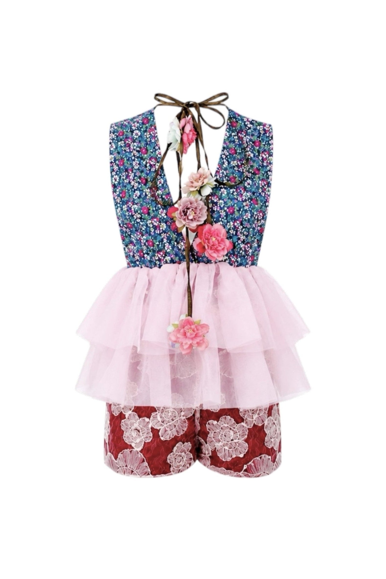 Children's outfit with floral vest, pink ruffled top, and red shorts on a white background