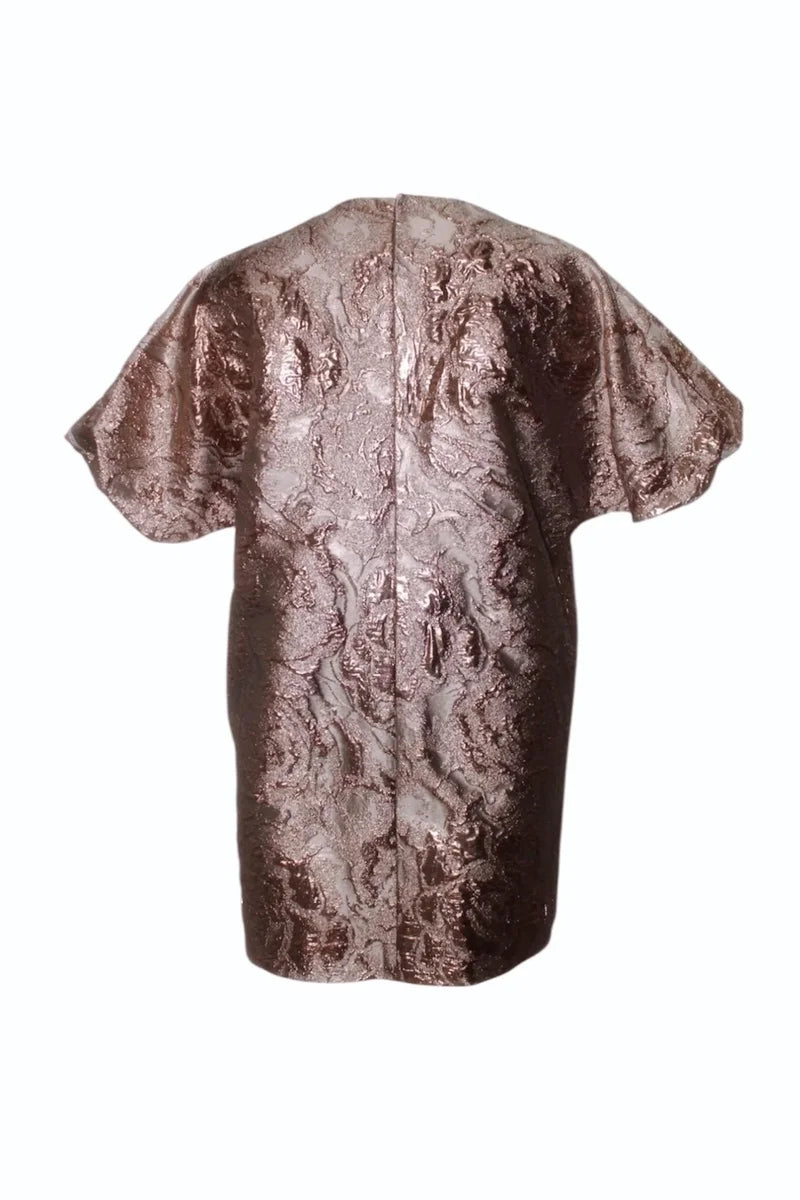 Bronze-colored lace dress on a white background