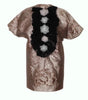 Decorative item with a black floral pattern on a textured surface