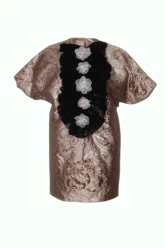 Decorative item with a black floral pattern on a textured surface