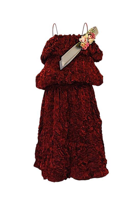 Brown textured dress with a decorative belt on a white background