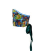 Colorful strapless top with floral pattern and green ribbon on a white background