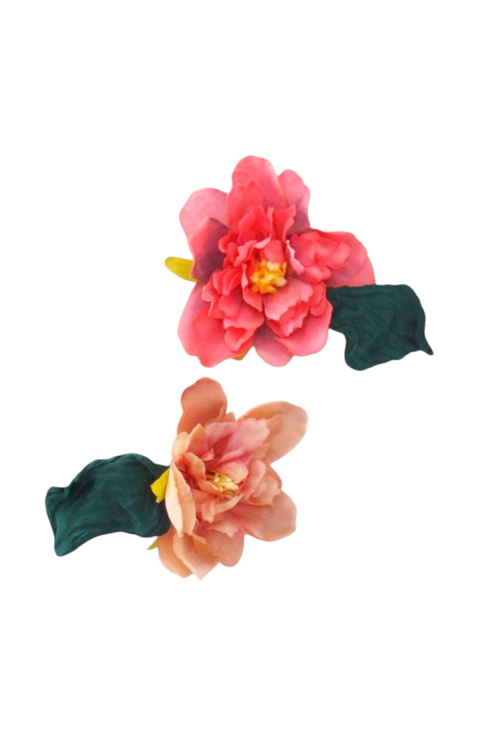 Two floral hair clips with pink and green colors on a white background
