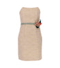 Beige strapless dress with a floral detail on a white background