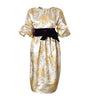 Gold and white floral dress with a purple belt on a white background