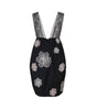 Black dress with floral lace patterns on a white background