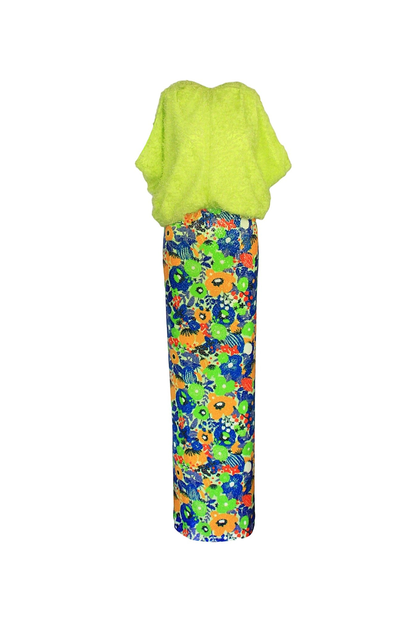 Green top and colorful floral pants on a white background