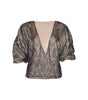 Patterned blouse with puff sleeves on a white background