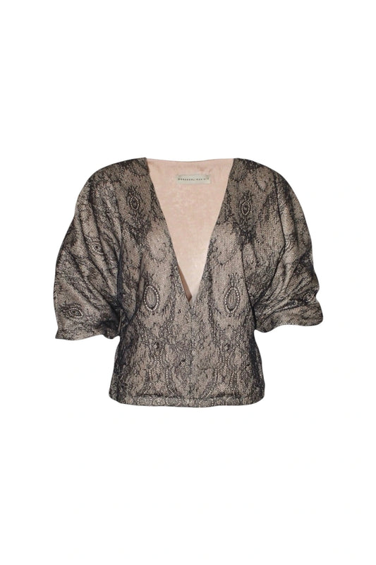Patterned blouse with puff sleeves on a white background