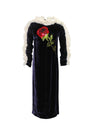 Black velvet dress with floral embroidery on a white background