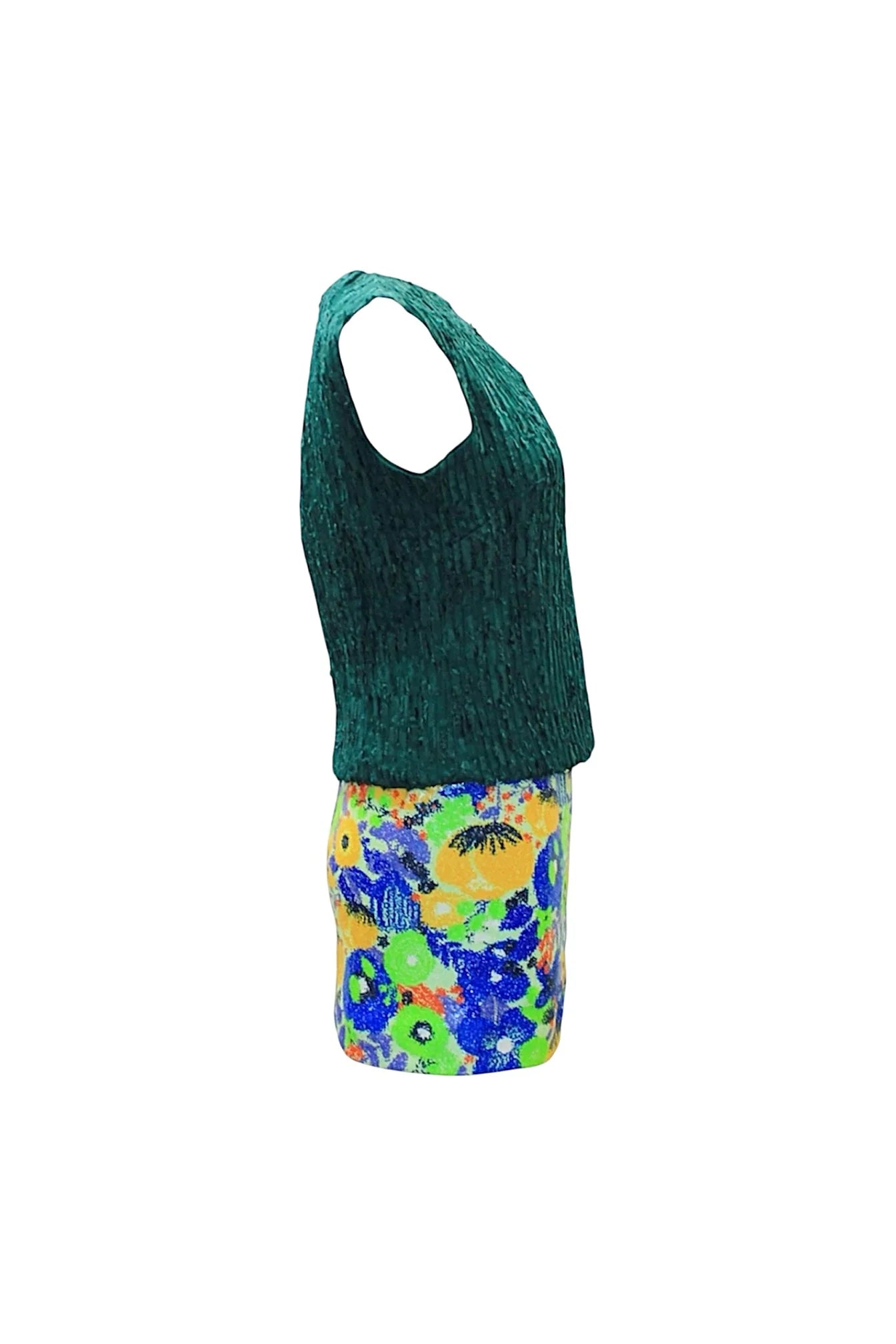 Green sleeveless top and colorful floral shorts on a white background