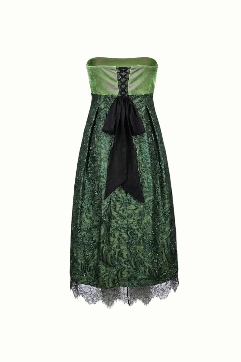 Green strapless dress with black accents on a white background