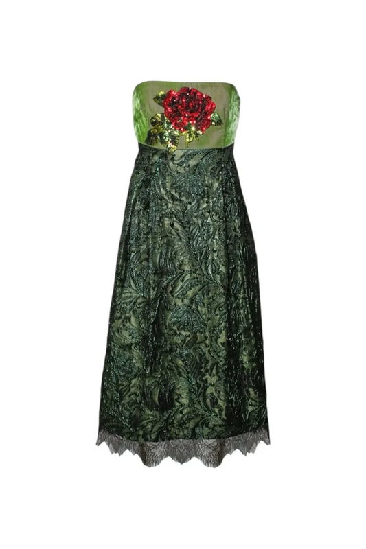 Green lace dress with floral embroidery on a white background