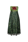 Green lace dress with floral embroidery on a white background