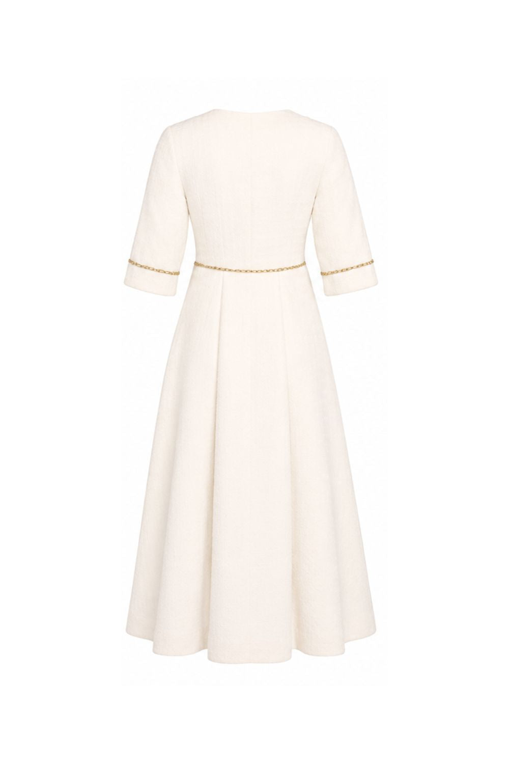 White dress with gold trim on a white background