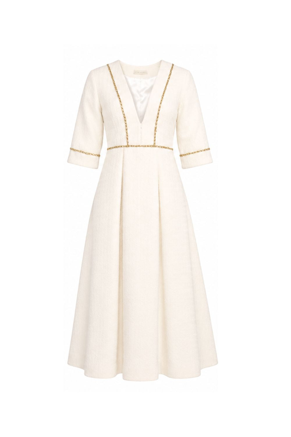 White dress with gold trim on a white background