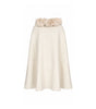 White skirt with floral embellishments on a white background