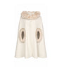 White cape with fur trim on a white background