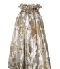 Gold and silver floral patterned dress on a white background