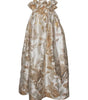 Gold and white floral dress on a white background