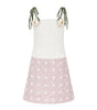 White apron with pink polka dot skirt on a white background
