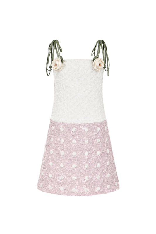 White apron with pink polka dot skirt on a white background