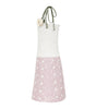 Two-tone apron with white top and pink polka dot skirt on a white background