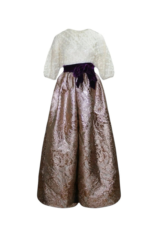 Two-piece outfit with lace top and metallic skirt on a white background