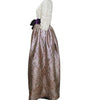 Costume with metallic skirt and white hood on a white background