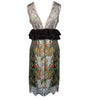 Dress with floral pattern and lace details on a white background
