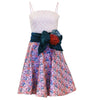 Dress with floral skirt and decorative bow on a white background