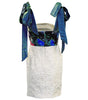 White paper bag with blue ribbons and a colorful label on a white background