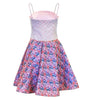 Dress with floral skirt and patterned top on a white background