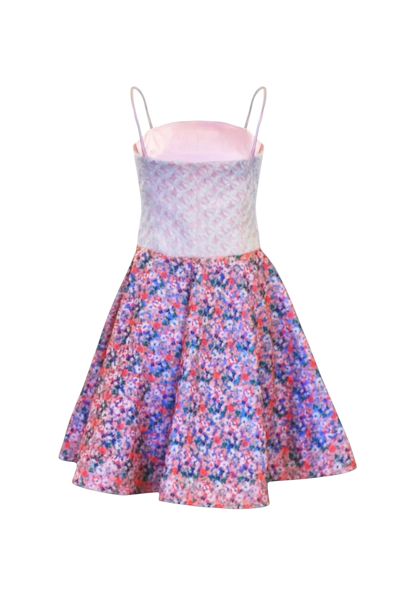 Dress with floral skirt and patterned top on a white background