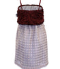 Dress with maroon top and patterned skirt on a white background