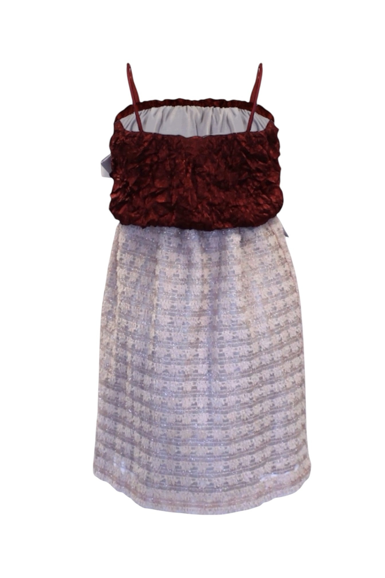 Dress with maroon top and patterned skirt on a white background