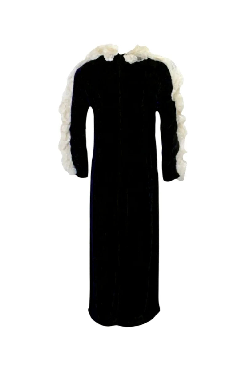 Black dress with white lace trim on a white background