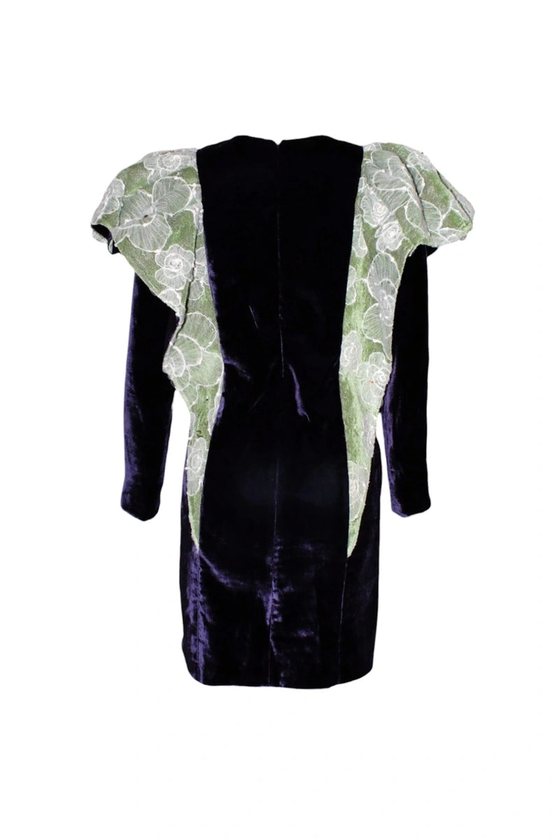 Black dress with green floral sleeves on a white background