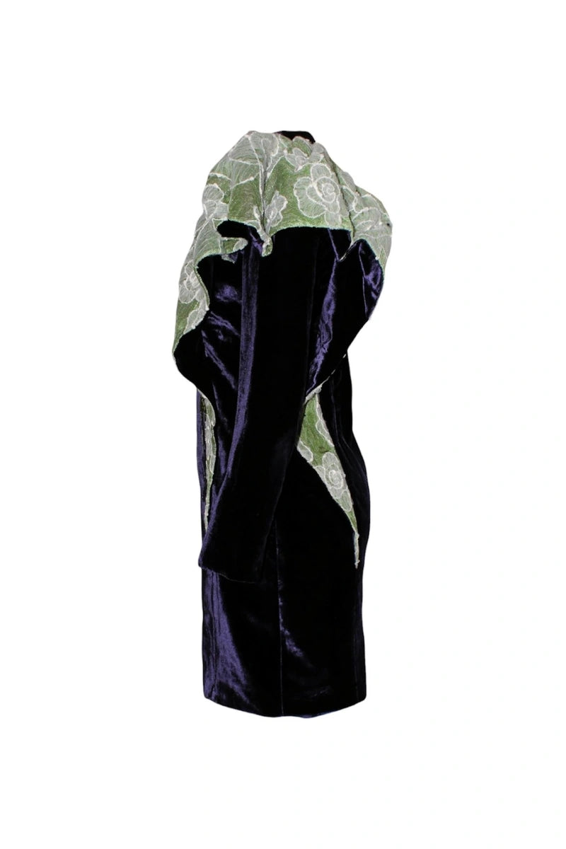 Black garment with a green floral hood on a white background