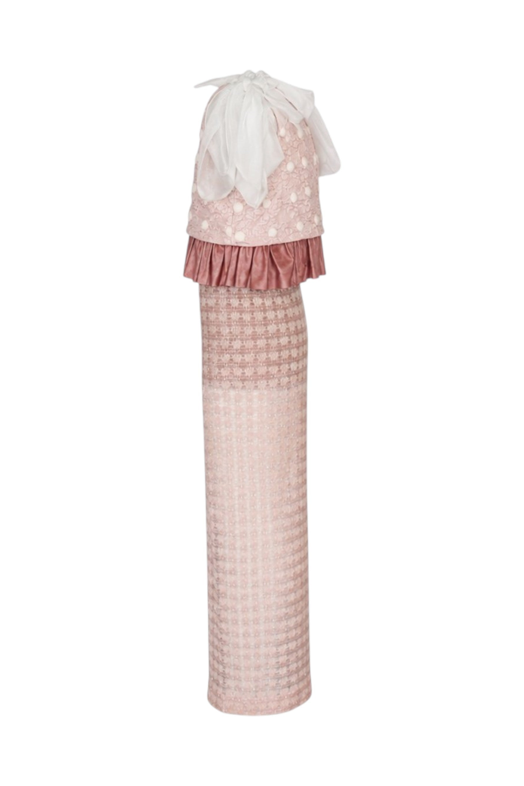 Long, patterned dress with a ruffled top on a white background